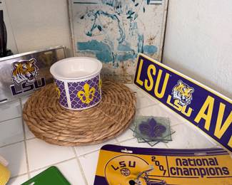 LSU décor, signs, cups, license plates, collectibles, John Deere sign & vintage Saturday Evening Post wall art.