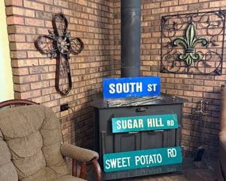 Street signs, iron wall, decor, and glider rocker
