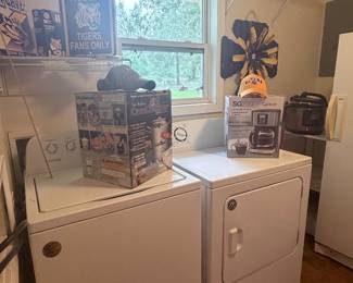 Whirlpool washer & dryer, laundry room shelving, household items, LSU décor, and more