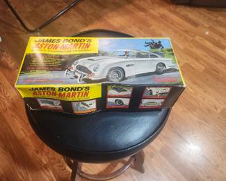 Vintage James Bond Aston Martin DB5 battery-operated toy from Goldfinger and Thunderball (circa 1965-1967). Includes original box and ejector seat figure. Features working bullet-proof shield, machine guns, revolving license plates, ejector seat and other spy gadgets. Excellent collector's item. $695 plus actual shipping or local pickup.
