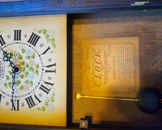 New England Clock Co. battery pendulum wall clock, dated 1967. Floral Roman numeral dial, brass pendulum, original instructions inside case. Runs on one C battery. Condition as shown. Buyer pays shipping or local pick up. Price $45.