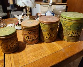 Here's my quick assessment of these three items:  1. Vintage Kitchen Canister Set (Tea, Coffee, Sugar, Flour) Value as a set: $50–80 Estate sale: $40–60 Facebook Marketplace: List for $75, expect $50–65 These reproduction vintage-style tins are decorative rather than antique, but people buy complete matching sets.