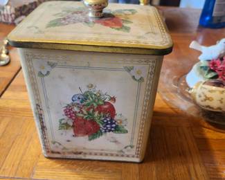 Vintage Fruit Design Metal Storage Tin  Price: $12  Vintage metal storage tin with fruit design and matching lid. Great for kitchen storage or farmhouse décor.  Condition: Good vintage condition with age-related wear and light rust spots.  Estimated Value:  Estate Sale: $12 Online: $15–25 Antique Shop: $25–35  Buyer pays shipping or local pickup available.
