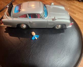 Vintage James Bond Aston Martin DB5 battery-operated toy from Goldfinger and Thunderball (circa 1965-1967). Includes original box and ejector seat figure. Features working bullet-proof shield, machine guns, revolving license plates, ejector seat and other spy gadgets. Excellent collector's item. $695 plus actual shipping or local pickup.