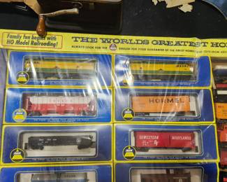Vintage HO Scale Train Collection. New Old Stock and never opened. Includes numerous locomotives, freight cars, and accessories in original factory packaging and display box. Estate fresh and collector quality. Contents appear complete and unused. Ideal for train collectors or hobby enthusiasts. Asking $395 OBO.