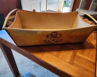 Decorative Faux‑Leather Storage Containers – Sold as a Pair   Includes one purple embossed oval container and one yellow rectangular handled organizer. Faux‑leather/vinyl construction with decorative patterns. Great for home decor, craft storage, or tabletop organization. Condition as shown. EstateSales.net Price: $15  Buyer pays shipping or local pick up.