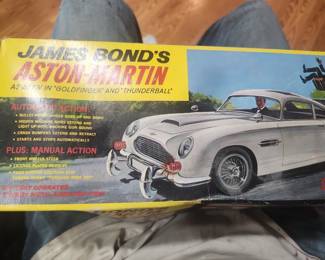 Vintage James Bond Aston Martin DB5 battery-operated toy from Goldfinger and Thunderball (circa 1965-1967). Includes original box and ejector seat figure. Features working bullet-proof shield, machine guns, revolving license plates, ejector seat and other spy gadgets. Excellent collector's item. $695 plus actual shipping or local pickup.