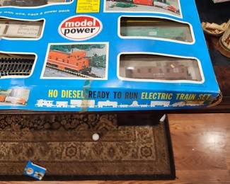 Model Power HO Diesel Ready‑to‑Run Electric Train Set – New Old Stock – Unused – Original Box  Vintage Model Power HO‑scale electric train set, complete and unused, still in the original box. This is true New Old Stock (NOS) — contents appear untouched and never assembled. Includes diesel locomotive, freight cars, track sections, power pack, and accessories. Packaging is clean and intact with clear display windows.  A great collectible for model railroad enthusiasts or anyone looking for a ready‑to‑run HO set in exceptional condition. Hard to find unused examples from this era.  Condition:  New Old Stock (unused)  Original box included  All components present  Box shows only minor shelf wear  Price: $75 Era: Late 1980s–1990s Includes: Locomotive, cars, track, power pack, accessories, original box