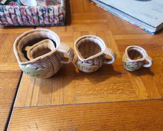 Vintage Ceramic Measuring Cup Set – Rustic Basket Weave Design (Set of 3)  Charming vintage ceramic measuring cup set featuring a rustic basket weave design with embossed handles and hand-painted measurement markings. Includes 1 Cup, 1/2 Cup, and 1/4 Cup sizes. These decorative yet functional measuring cups are perfect for farmhouse kitchens, country décor, baking enthusiasts, or vintage pottery collectors.  Crafted with a warm brown and cream glaze, this attractive three-piece set displays beautifully on open shelving or in a rustic kitchen.  Features:  Complete 3-piece measuring cup set Includes 1 Cup, 1/2 Cup, and 1/4 Cup Rustic basket weave design Brown and cream glazed finish Decorative and functional Mold number: 53/234  Condition: Good vintage condition with normal age-related crazing and light wear. No major chips or cracks visible. Please review all photos.  Estate Sale Price  $25.00  Shipping  Buyer pays actual shipping. Local pickup is also available.
