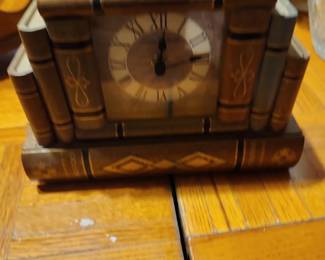 3. Book-Shaped Mantel Clock Decorative quartz clock. Value: $20–40 Estate sale: $10–20