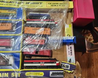 Vintage HO Scale Train Collection. New Old Stock and never opened. Includes numerous locomotives, freight cars, and accessories in original factory packaging and display box. Estate fresh and collector quality. Contents appear complete and unused. Ideal for train collectors or hobby enthusiasts. Asking $395 OBO.