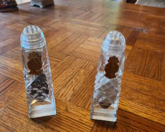 Vintage crystal-style salt and pepper shakers with gold crown emblems and faceted cut-glass design. Elegant table display pieces. Good condition as shown. Buyer pays shipping or local pick up. Price $20 for the pair.