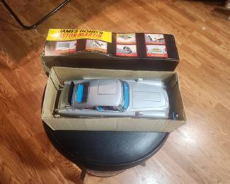 Vintage James Bond Aston Martin DB5 battery-operated toy from Goldfinger and Thunderball (circa 1965-1967). Includes original box and ejector seat figure. Features working bullet-proof shield, machine guns, revolving license plates, ejector seat and other spy gadgets. Excellent collector's item. $695 plus actual shipping or local pickup.