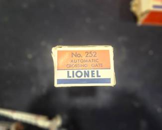 EstateSales.net Description  Lionel No. 252 Automatic Crossing Gate (1949-1966) – Postwar O Gauge accessory. New Old Stock and estate fresh in its original Lionel factory box. A highly collectible operating accessory that automatically lowers and raises as trains pass. Excellent collector-grade example for any Lionel postwar layout or collection. $125 plus actual shipping costs or local pickup available.