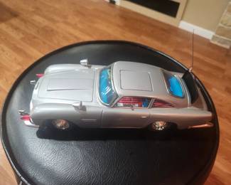 Vintage James Bond Aston Martin DB5 battery-operated toy from Goldfinger and Thunderball (circa 1965-1967). Includes original box and ejector seat figure. Features working bullet-proof shield, machine guns, revolving license plates, ejector seat and other spy gadgets. Excellent collector's item. $695 plus actual shipping or local pickup.
