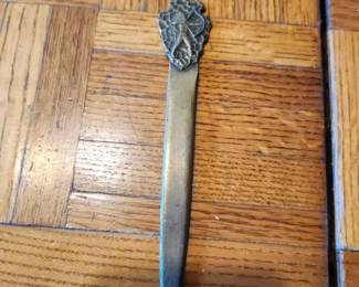 Vintage metal letter openers sold as a group. Includes ornate designs, figural handles, Norway marked piece, lion motif, and decorative blades. Mixed metals, all with detailed craftsmanship. Condition as shown. Buyer pays shipping or local pick up. Price $25 for the group.