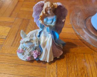 Angel Figurine  Price: $12  Decorative angel figurine holding a star with doves and floral accents. Great for holiday or year-round display.  Condition: Good pre-owned condition.  Estimated Value:  Estate Sale: $12 Online: $15–25 Gift Shop: $25–35  Buyer pays shipping or local pickup available.