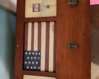 Handcrafted wooden Americana shadow box featuring a distressed American flag and three-display design for photos or memorabilia. Rustic farmhouse style with metal hardware and warm wood finish. A great patriotic décor piece for home, cabin, or office. $45 plus shipping or local pickup.
