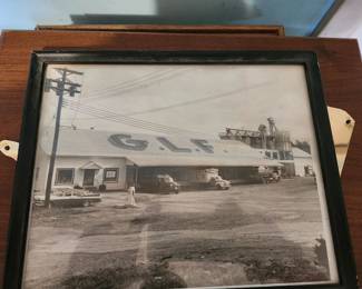 Vintage framed black-and-white photograph featuring the historic GLF (Grange League Federation) building, early automobiles, and industrial Americana. A unique piece of agricultural and local history in its original wood frame. Great for collectors or farmhouse décor. Estate fresh condition. $195 plus shipping or local pickup.