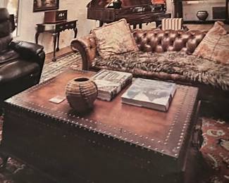 Leather wrapped coffee table with two drawers.