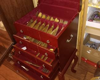 Full set brass flatware in cabinet