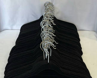 Lot 151: Stack of black 'velveteen' clothes hangers