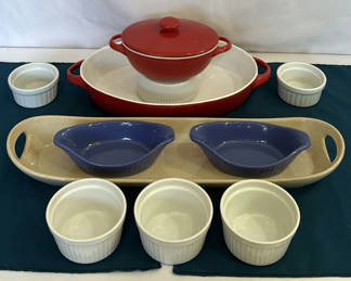 Lot 106: Red enamel Dutch oven with lid, blue oval bowls, beige rectangular tray, and white ramekins