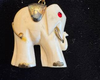 Elephant pendant (appears to have 25 on loop)