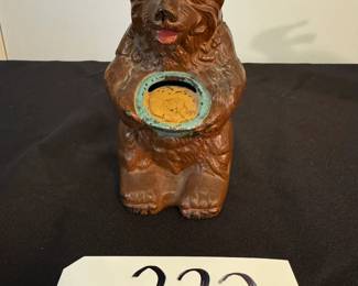 Vintage cast iron bear coin bank - bear holding pot
