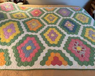 Grandmother's flower garden quilt, 62" x 93" has small stain on back
