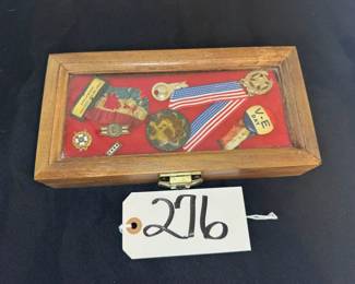 Assorted Military pins and badges in wood case with glass cover
