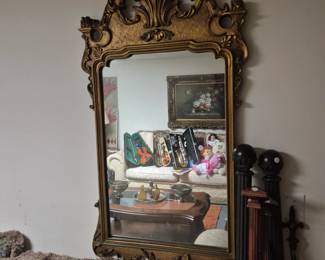 Vintage Antique Style Wall Mirror. To the right, Decorative Curtain Rods