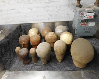 Collection of various sized wigblocks for wig making