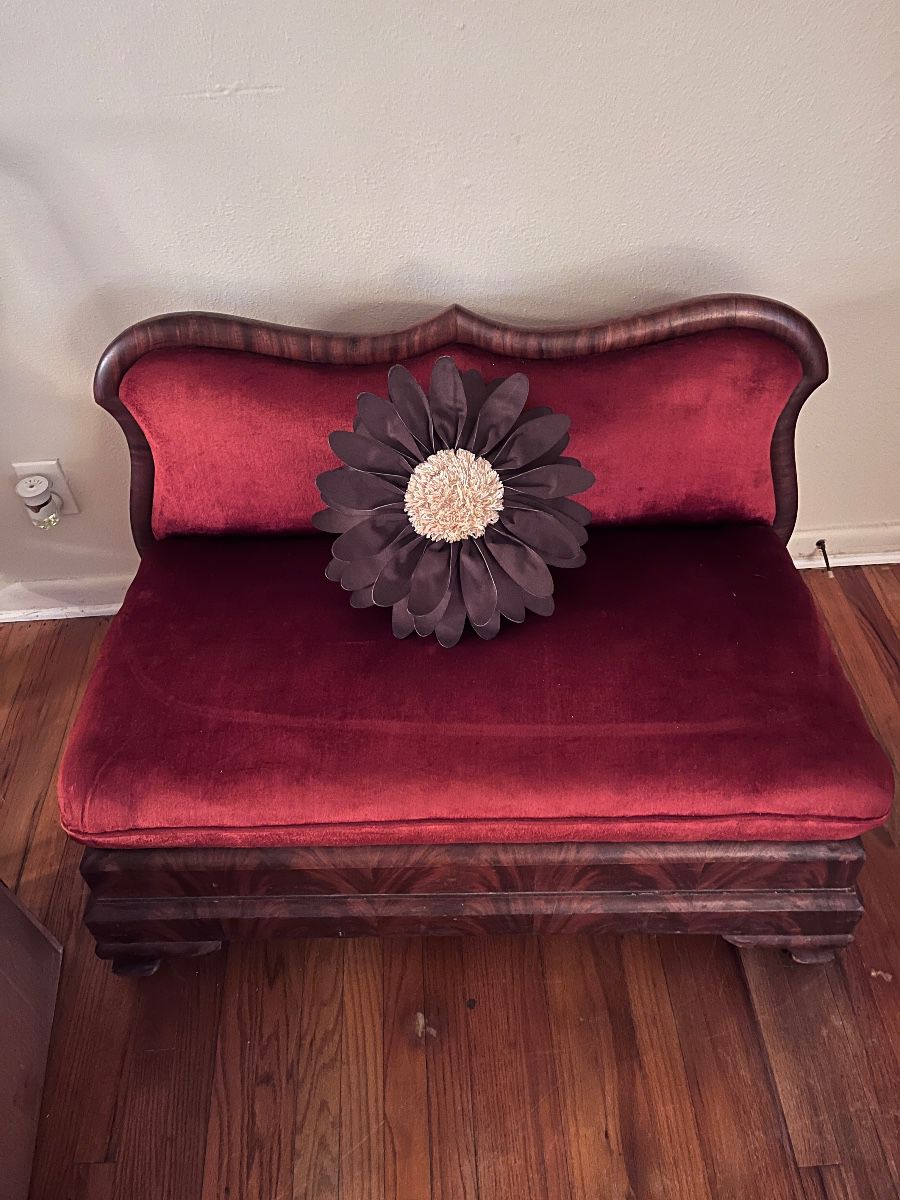 Wood carved and red velvet vintage Victorian-style loveseat