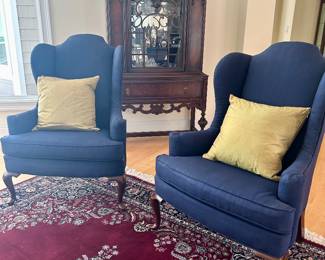 pair of matching wingback chairs