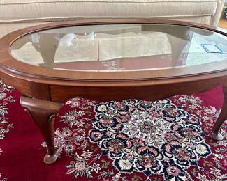 45” by 27” oval glass top coffee table 