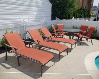 Pool chaises - 4 available. Patio dining set seats 4