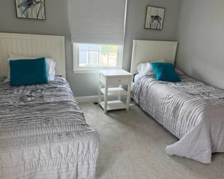 Twin bedroom suite: 2 twin beds; 1 nightstand; 1 tall dresser