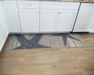 Kitchen cabinetry detail; area rug