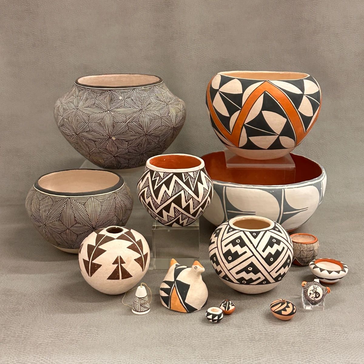 Pueblo pottery from the southwest including these vibrant hand-made and hand-decorated bowls and jars; several from Acoma Pueblo artists including Jessic Garcia, Lucy M. Lewis, Pablita Concho, and Marie and Simon Vallo; and a San Felipe Pueblo bowl from artist A. Tenorio 