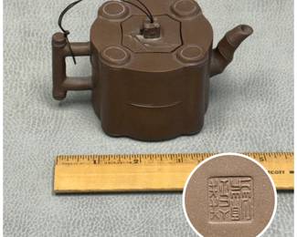 A vintage Chinese Yixing zisha (purple clay) teapot featuring a segmented bamboo-section design with a cylindrical multi-sided body and detailed applied branch motifs; makers mark to base