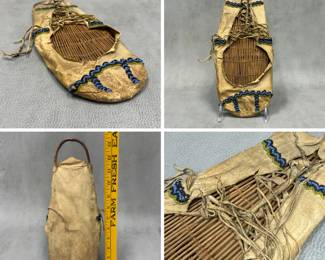 Antique traditional Native American Indian beaded hide and basketry toy cradle board, doll-sized, 13.25"H; constructed with a woven willow basketry base/back, a bent wooden support frame, and a native-tanned hide (buckskin) cover. Decorated with geometric zigzag pattern of hand-sewn blue, green, white, and black glass seed-beads.