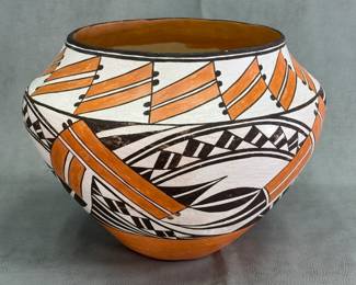 A beautiful large Acoma Pueblo polychrome pottery jar, approx. 10 inches tall, marked with “Acoma” on the base along with artisan initials “ML.” The traditional white-slip background is beautifully contrasted by black mineral paint and warm terracotta-orange slip, creating a classic three-color polychrome design.