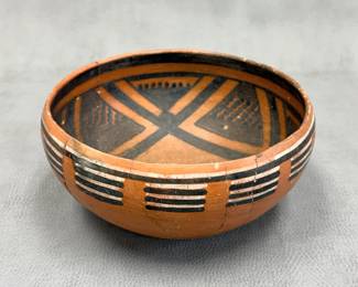 A prehistoric Native American ceramic bowl, approx. 10 inches wide, likely a Four Mile Polychrome piece made by the Ancestral Puebloan (Anasazi) culture around the 13th/14th century. Handwritten label on the underside reads "XSR-8 Pinedale poly circa 1275 AD." See similar examples in Metropolitan Museum, NY;  Brooklyn Museum, NY, and others.
