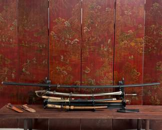 Two vintage Japanese katana swords with orange speckle kaya, 27.5” and 42”; an antique 19th-century military saber, closely resembling a U.S. Model 1840 or Model 1860 light cavalry/artillery saber with its original metal scabbard, 42”; a vintage fencing weapon (foil or épée) w/a traditional Italian grip and a round metal guard (bellguard), 43”; a vintage 1976 Ontario GI Air Force 499 pilot survival knife with leather scabbard; and a U.S. WWII M3 trench knife or sterile fighting knife w/a flaming bomb inspection mark on the pommel with post-war sheath