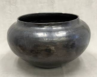 A large 12-inch tall Southwest Native American blackware ceramic olla or vessel, consistent with traditional Pueblo pottery styles such as those from Santa Clara or San Ildefonso