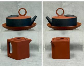 Contemporary Chinese clay teapots - a CCCI (Chinese Ceramic Center Inc.) red and black clay teapot with dish, mark to base; and a modern geometric Yixing zisha clay teapot in a striking minimalist cube shape with a flush lid and an integrated loop handle, chop mark to base.