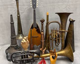 Antique and vintage instruments including a circa 1900 antique silver-plated brass cornet with ornate floral-etched bell and three piston valves, marked Beau Ideal Chicago; antique 19th century fireman’s brass speaking trumpets (or loud hailer/megaphones); a Washburn bowlback (tater bug) mandolin, likely manufactured by Lyon & Healy in Chicago during the late 19th or early 20th century; pair of vintage, articulated wooden mannequin hands with jointed fingers  