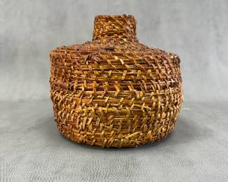 Native American pitch-covered woven jar, 7-1/2" tall