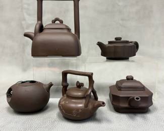 A collection of vintage Chinese Yixing teapots in various sizes, shapes and styles; all with maker's marks to bases and interiors of lids